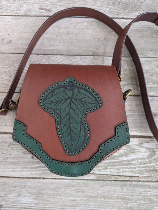 Handcrafted full grain leather convertible bag with green elven leaf appliqué and shoulder strap