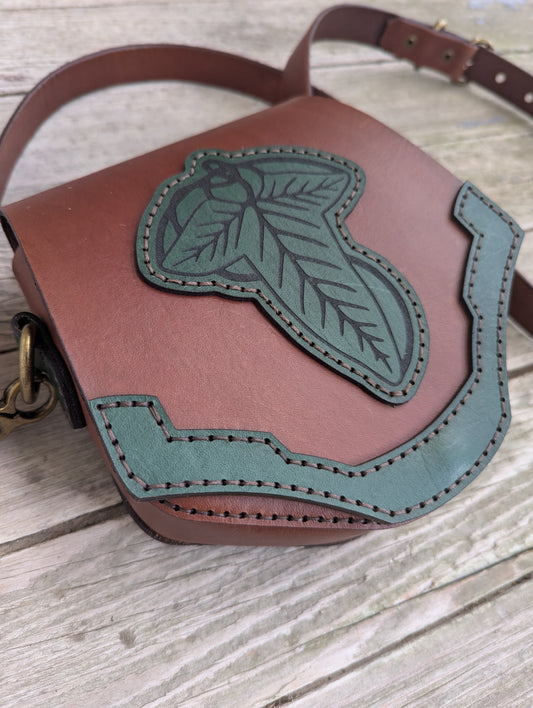 Handcrafted full grain leather convertible bag with green elven leaf appliqué and shoulder strap